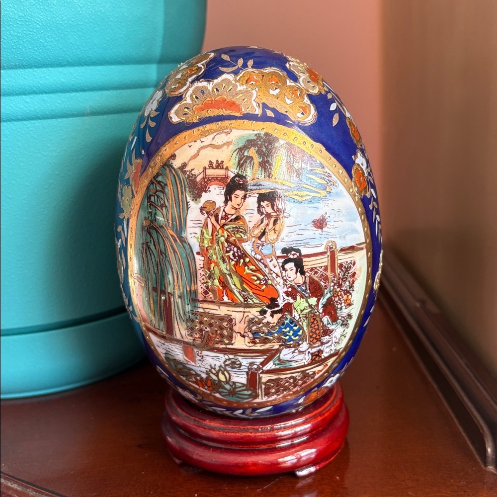 Artistic Blue and Gold Ceramic Egg by [Brand]